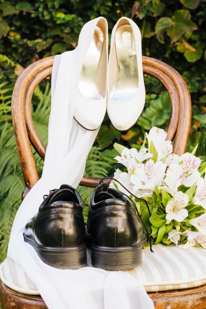 wedding-shoes-scarf-flower-bouquet-wooden-chair_23-2148187447